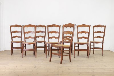Lot 466 - A set of eight provincial beech ladder-back chairs