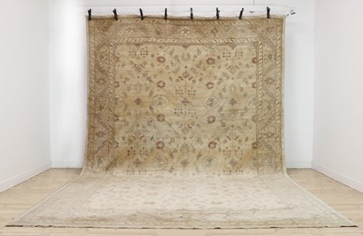 Lot 376 - A wool carpet of Persian Ziegler design