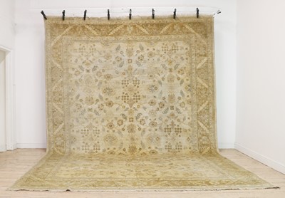 Lot 378 - A wool carpet of Persian Ziegler design