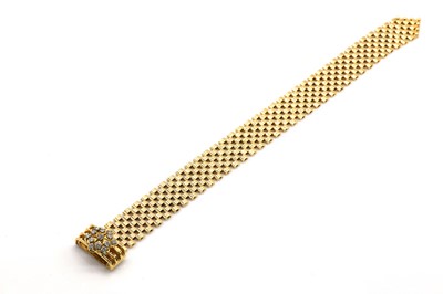 Lot 256 - An 18ct gold diamond set jarratière bracelet, by Nathan Brothers, c.1970