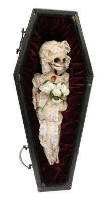 Lot 57 - A model child's skeleton in a coffin
