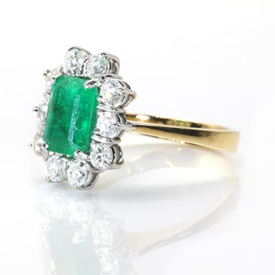 Lot 108 - An 18ct gold emerald and diamond rectangular cluster ring