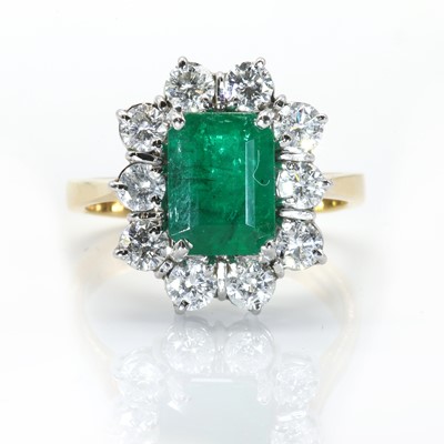 Lot 108 - An 18ct gold emerald and diamond rectangular cluster ring