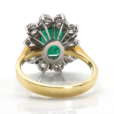 Lot 108 - An 18ct gold emerald and diamond rectangular cluster ring