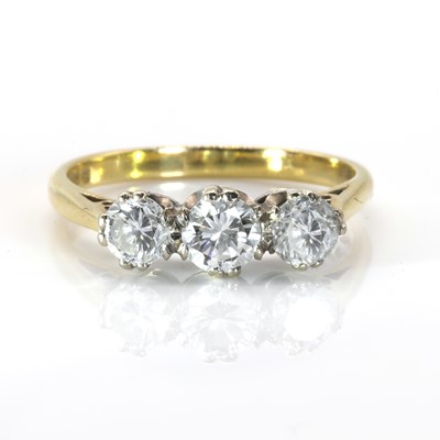 Lot 235 - An 18ct gold three stone diamond ring