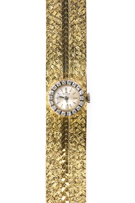 Lot 303 - A ladies' 18ct yellow and white gold, diamond set Bucherer mechanical cocktail watch, c.1985