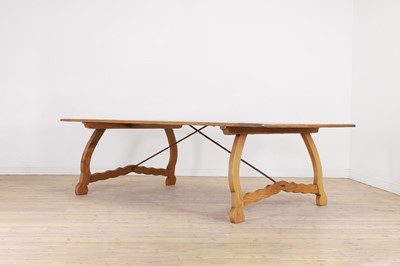 Lot 610 - A large golden oak dining table
