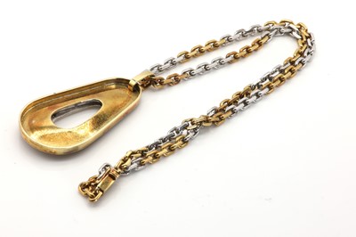 Lot 56 - A two colour gold diamond abstract design pendant
