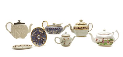 Lot 216 - A collection of porcelain teapots