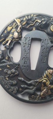 Lot 90 - A Japanese bronze tsuba and a kozuka