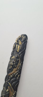 Lot 90 - A Japanese bronze tsuba and a kozuka