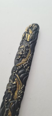 Lot 90 - A Japanese bronze tsuba and a kozuka