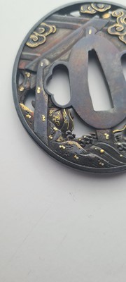Lot 90 - A Japanese bronze tsuba and a kozuka