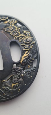 Lot 90 - A Japanese bronze tsuba and a kozuka