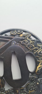 Lot 90 - A Japanese bronze tsuba and a kozuka