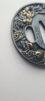 Lot 90 - A Japanese bronze tsuba and a kozuka