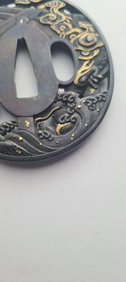 Lot 90 - A Japanese bronze tsuba and a kozuka