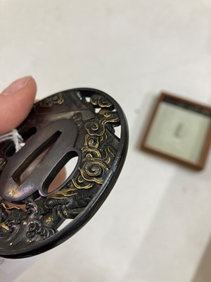 Lot 90 - A Japanese bronze tsuba and a kozuka