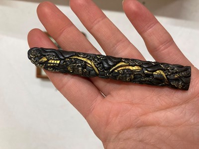 Lot 90 - A Japanese bronze tsuba and a kozuka