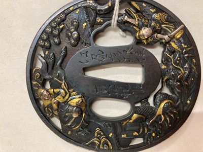 Lot 90 - A Japanese bronze tsuba and a kozuka