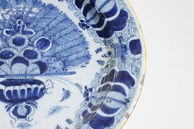 Lot 324 - A blue and white delft charger