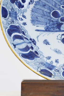 Lot 324 - A blue and white delft charger