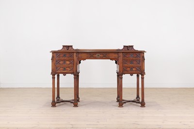 Lot 566 - A late Victorian Gothic Revival walnut desk