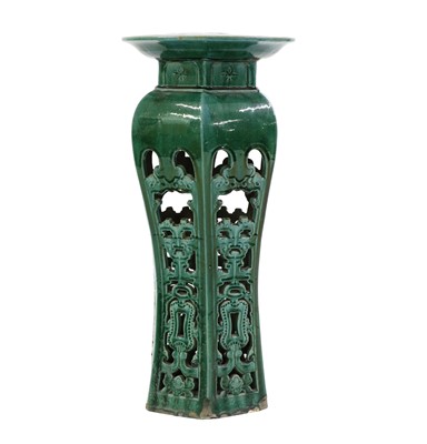 Lot 215 - A Chinese green glazed pottery jardiniere stand