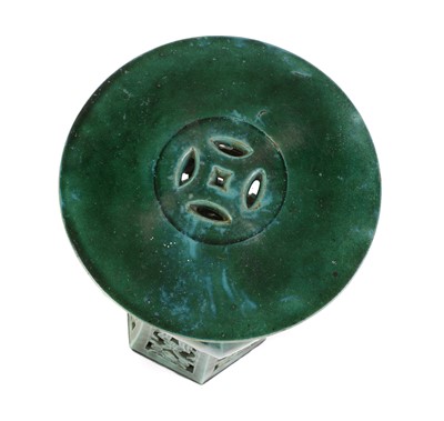 Lot 215 - A Chinese green glazed pottery jardiniere stand