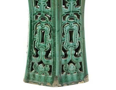 Lot 215 - A Chinese green glazed pottery jardiniere stand