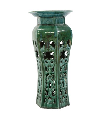 Lot 215 - A Chinese green glazed pottery jardiniere stand