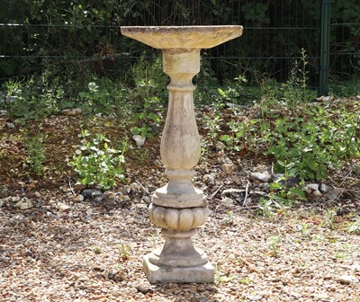 Lot 514 - A composite stone bird feeder