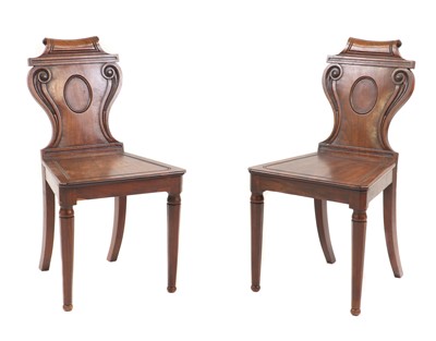 Lot 319 - A pair of Regency mahogany hall chairs