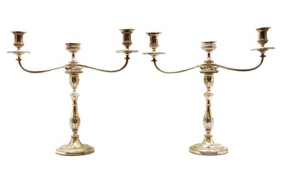 Lot 32 - A pair of silver candlesticks