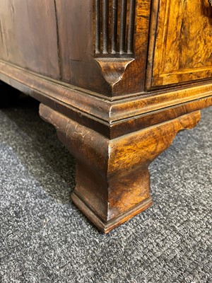 Lot 60 - A George II figured walnut kneehole desk