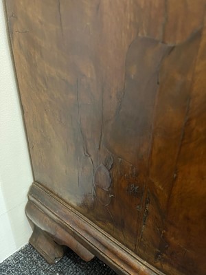 Lot 60 - A George II figured walnut kneehole desk
