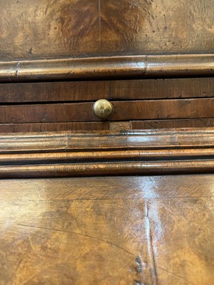 Lot 67 - A George I walnut bureau bookcase in the manner of Coxed & Woster