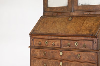 Lot 67 - A George I walnut bureau bookcase in the manner of Coxed & Woster