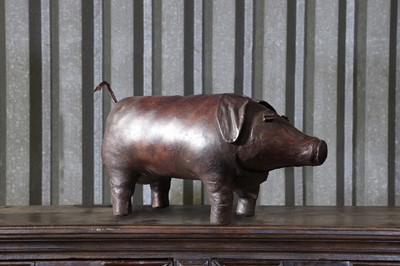 Lot 17 - A leather pig footstool in the manner of Dimitri Omersa for Liberty