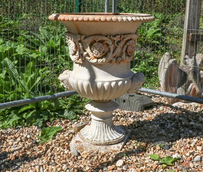 Lot 492 - A cast iron Campana garden urn