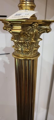 Lot 14 - A near pair of telescopic brass column floor lamps