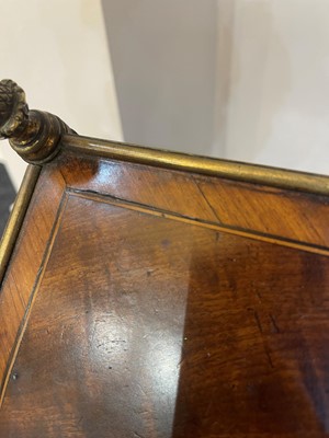 Lot 60 - A pair of Regency-style mahogany and brass étagères