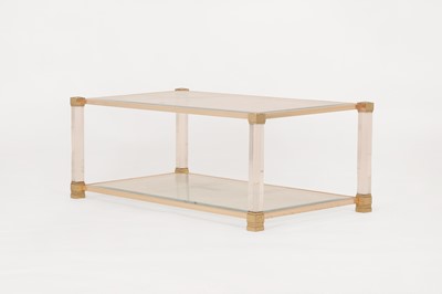 Lot 82 - A Lucite and brass coffee table