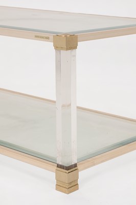 Lot 82 - A Lucite and brass coffee table