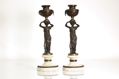 Lot 46 - A pair of Louis XVI patinated bronze and white marble candlesticks