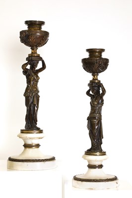 Lot 46 - A pair of Louis XVI patinated bronze and white marble candlesticks