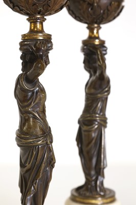 Lot 46 - A pair of Louis XVI patinated bronze and white marble candlesticks