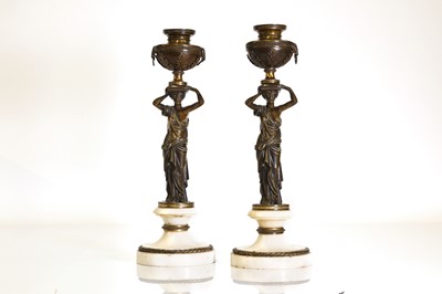 Lot 46 - A pair of Louis XVI patinated bronze and white marble candlesticks