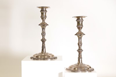 Lot 23 - A pair of George III silver candlesticks