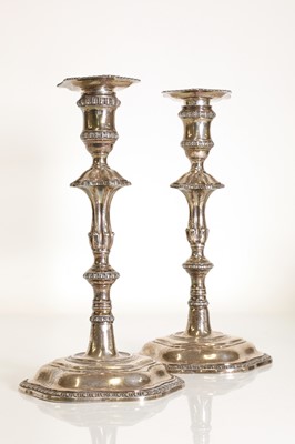 Lot 23 - A pair of George III silver candlesticks